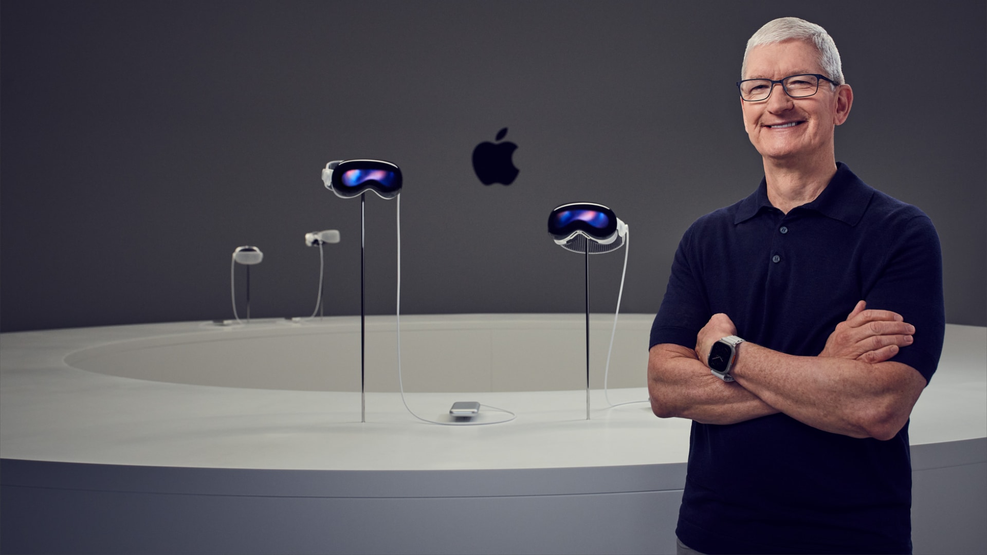 Tim Cook at Steve Jobs Theater standing next to Vision Pro