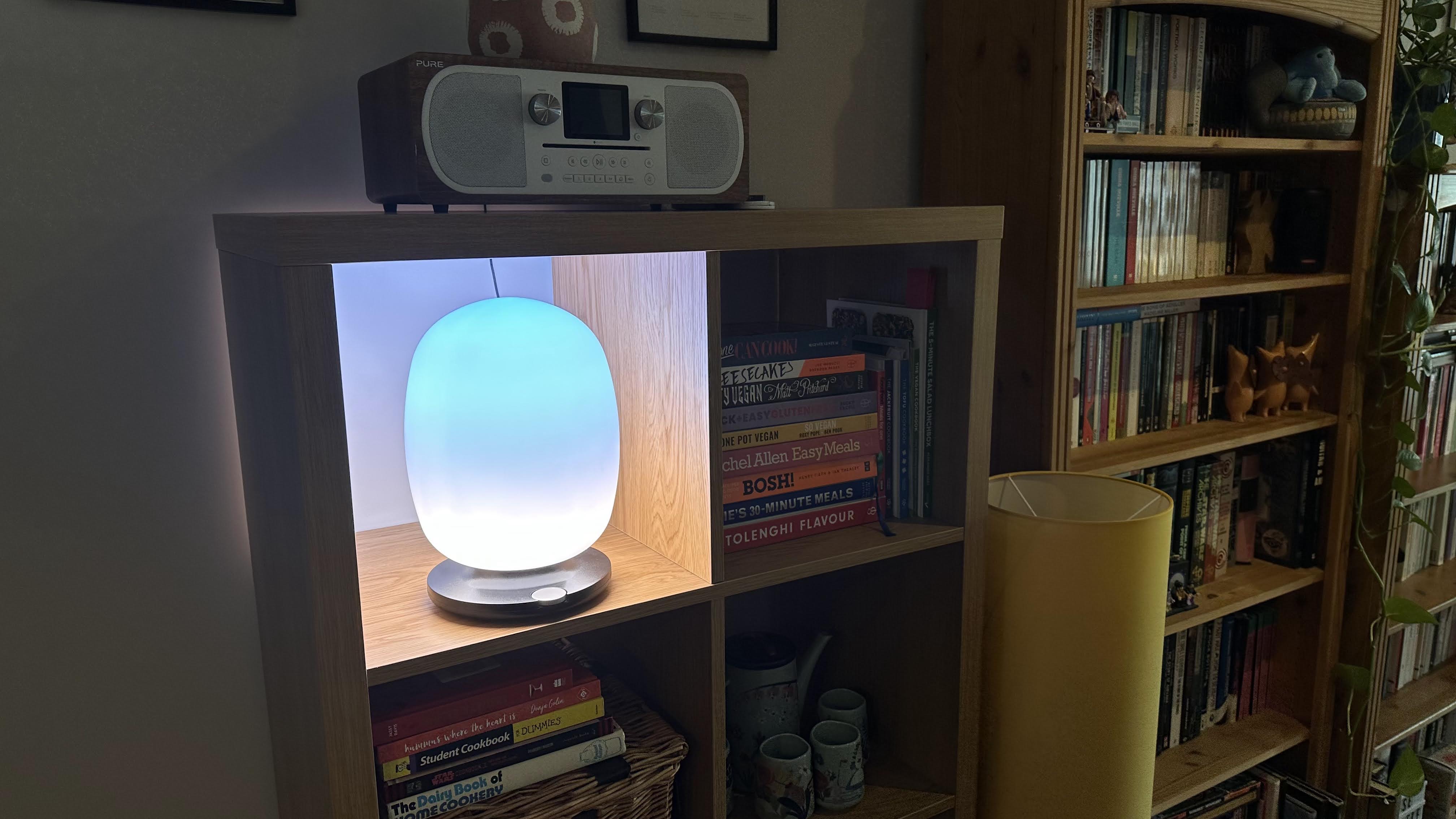 The SkyView 2 connected lamp on a wooden bookshelf