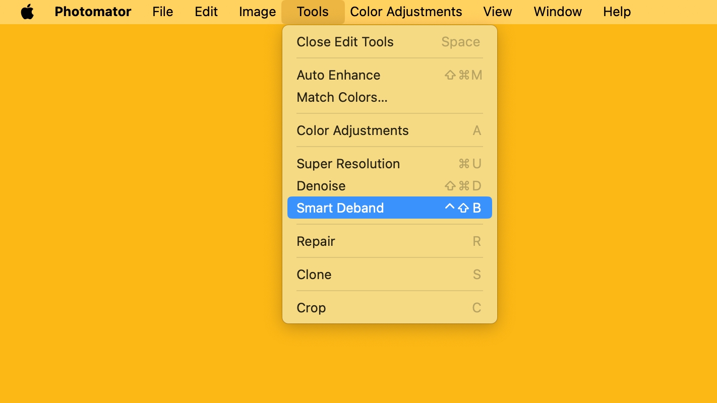The Smart Deband option selected in Photomator's Tools menu