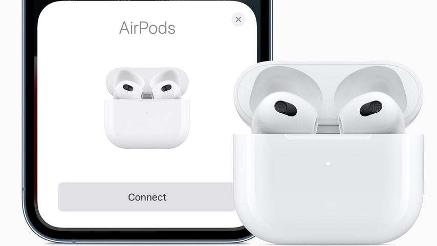 A close up of the AirPods 3 alongside an iPhone