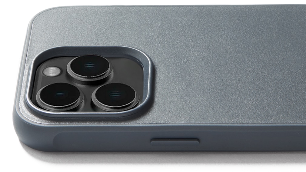 Closeup of the raised camera lip on Mujjo's iPhone 15 Pro case